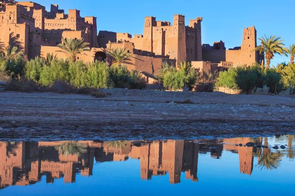 Kasbah Ait Ben Haddou with reflection in the river, UNESCO World Heritage site, Morocco.